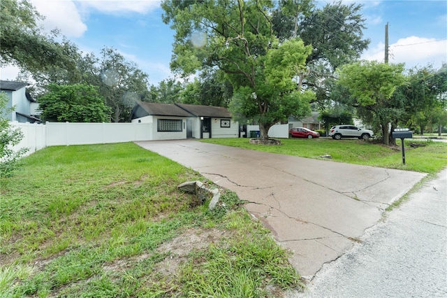 single story home featuring a front yard