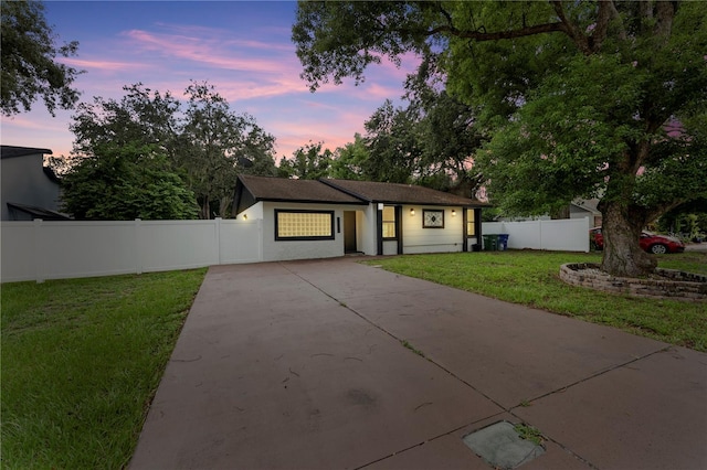 view of front of property with a yard