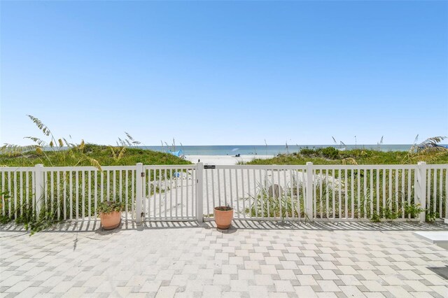 view of patio with a water view