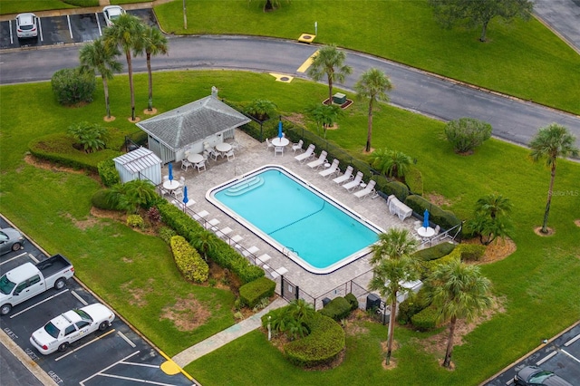 pool featuring fence and a patio