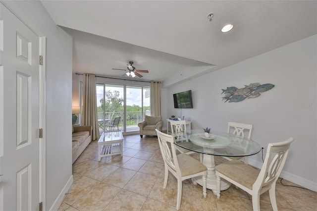tiled dining room with ceiling fan