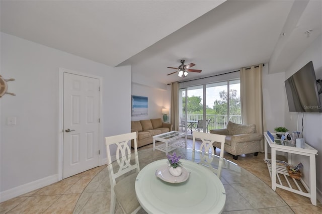 tiled dining room featuring ceiling fan