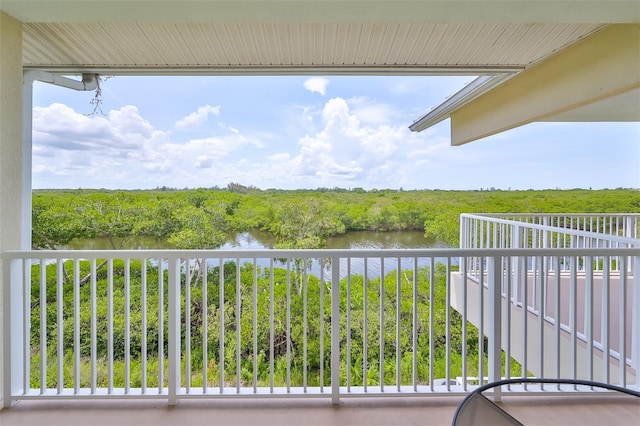 balcony featuring a water view