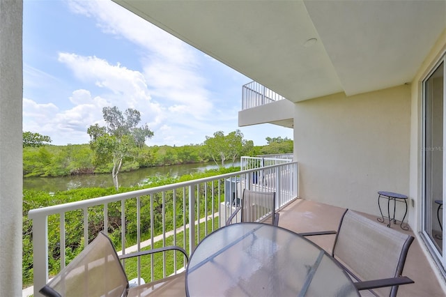 balcony featuring a water view
