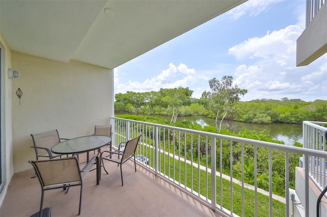 balcony featuring a water view