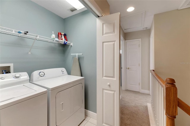 laundry area with light colored carpet and washing machine and dryer