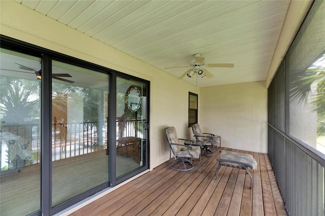 sunroom featuring ceiling fan