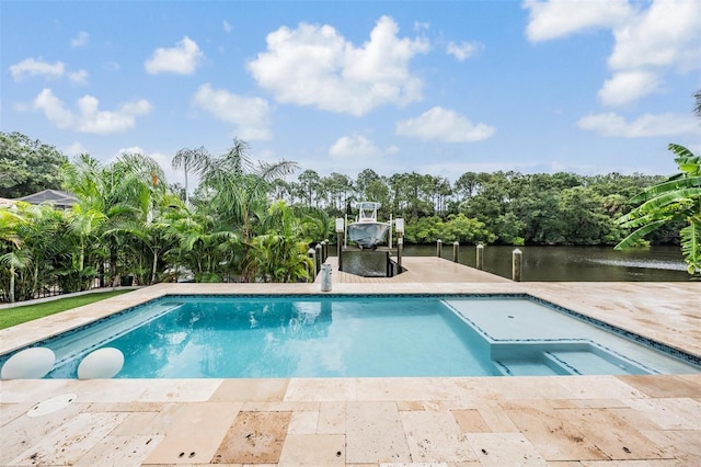 view of swimming pool featuring a boat dock