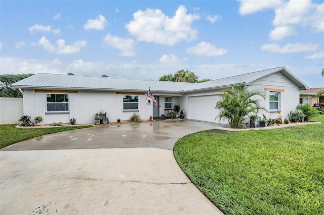 ranch-style home with a garage and a front yard