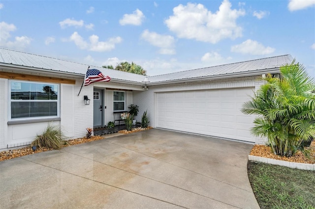 ranch-style home featuring a garage