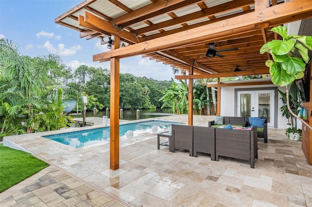 view of pool featuring french doors, ceiling fan, an outdoor hangout area, and a patio