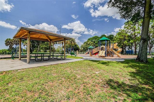 view of playground with a lawn