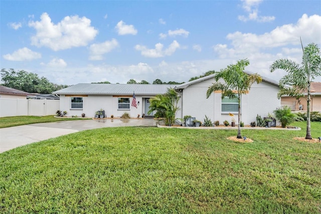 ranch-style home with a front lawn