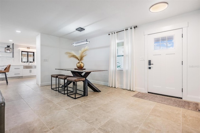 tiled entrance foyer featuring sink