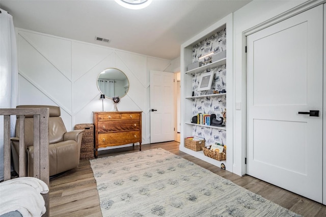 sitting room featuring wood-type flooring