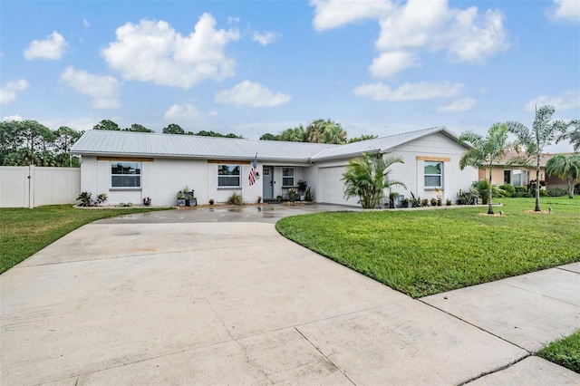 single story home with a garage and a front lawn