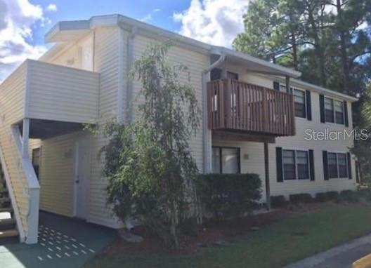 view of side of home with a balcony