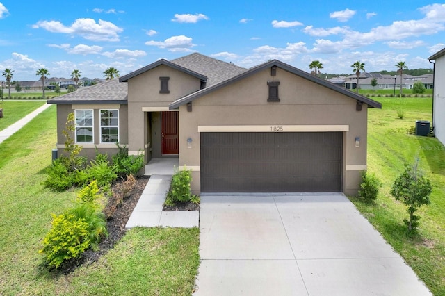 view of front of house featuring a garage and a front lawn