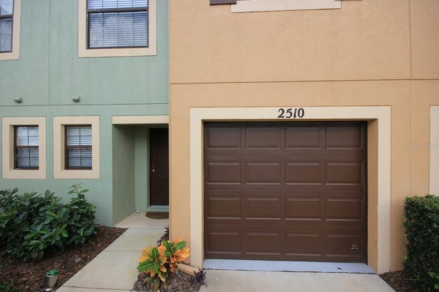 property entrance with stucco siding