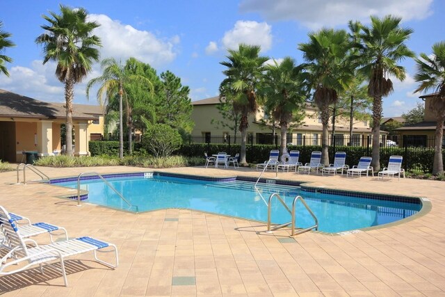 view of swimming pool featuring a patio area