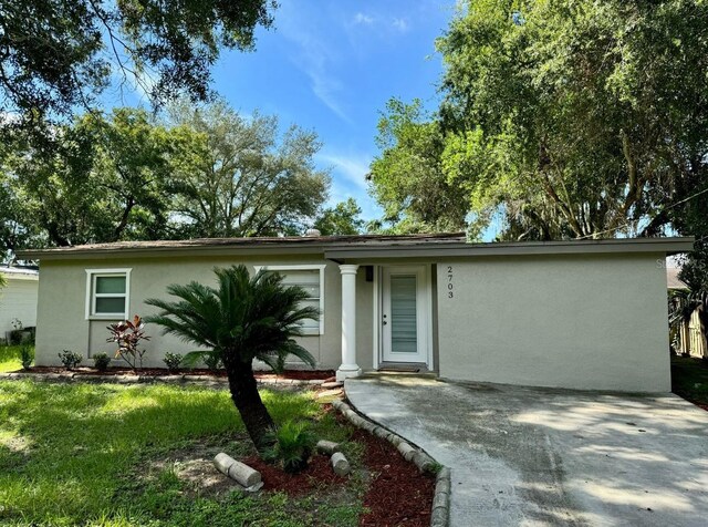 single story home featuring a patio