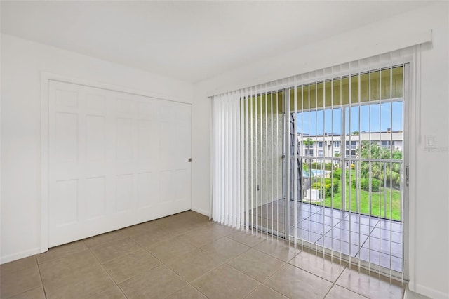 spare room with tile patterned floors