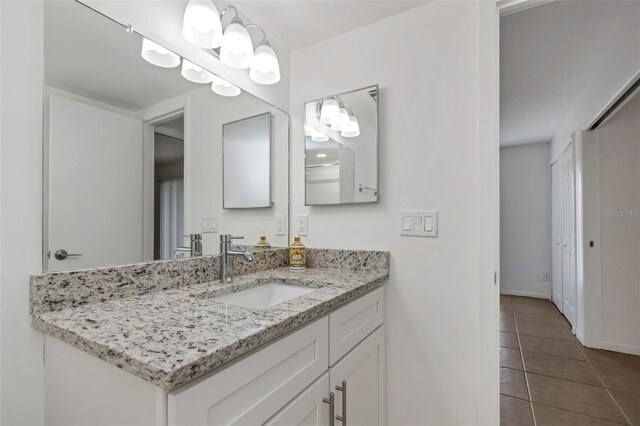 bathroom with vanity and tile patterned flooring