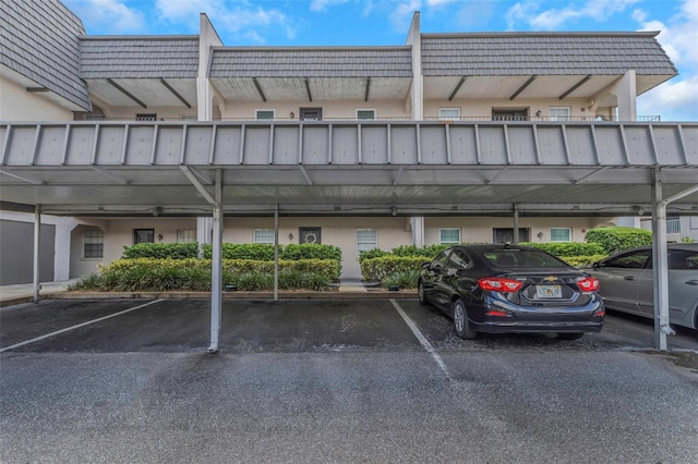 view of parking / parking lot featuring a carport