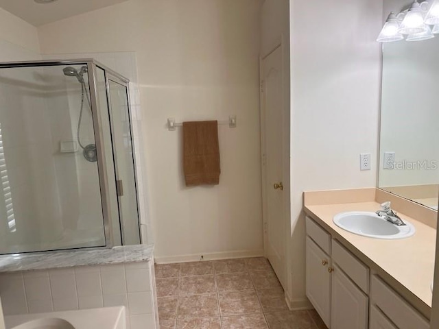 bathroom with vanity, tile patterned flooring, and an enclosed shower