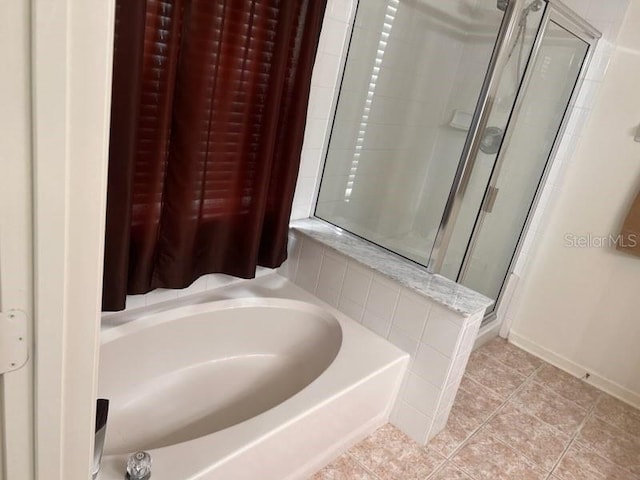 bathroom featuring independent shower and bath and tile patterned floors