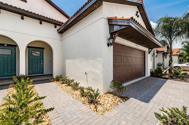 entrance to property featuring a garage