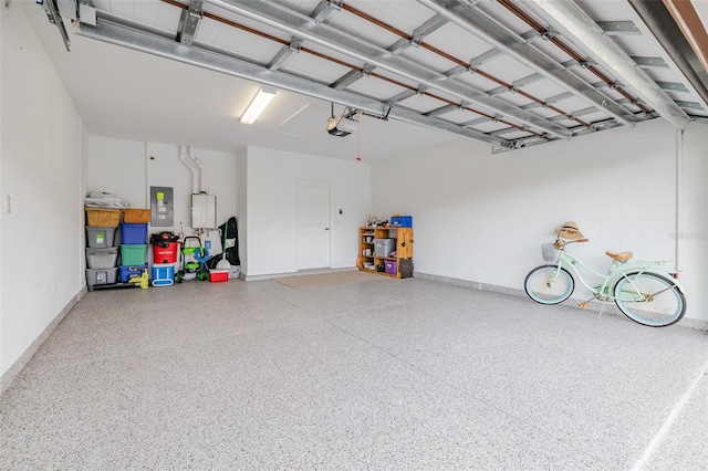 garage featuring electric panel and a garage door opener