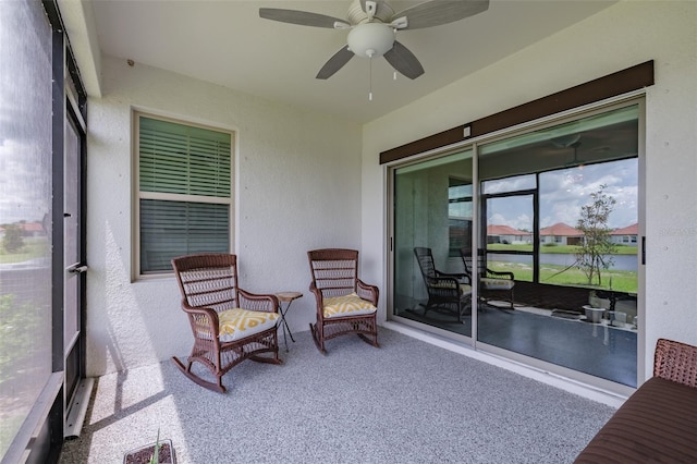 sunroom / solarium with ceiling fan