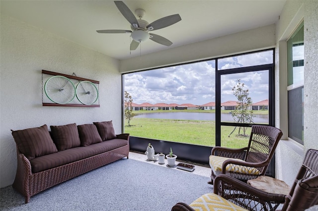 interior space featuring a water view and ceiling fan