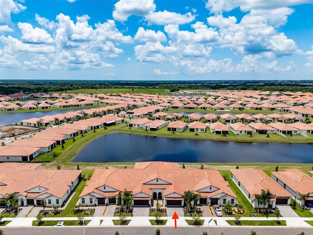 drone / aerial view with a water view