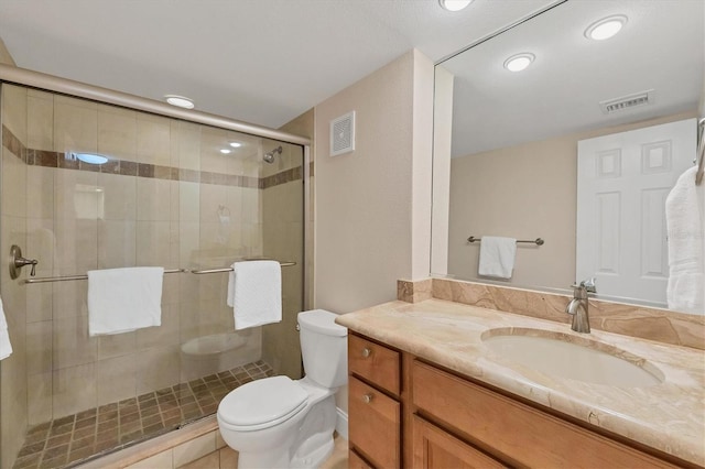 bathroom with walk in shower, toilet, and vanity