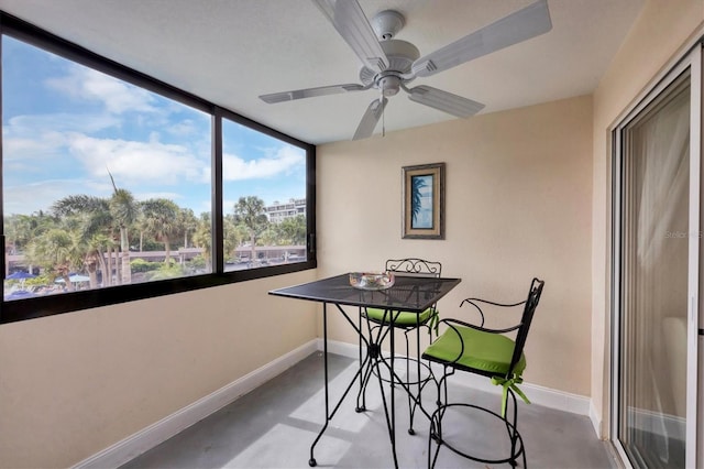 sunroom / solarium with ceiling fan