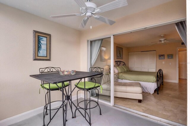 tiled bedroom with ceiling fan and a closet