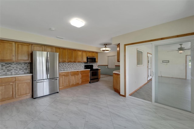 kitchen with backsplash, ceiling fan, and stainless steel appliances