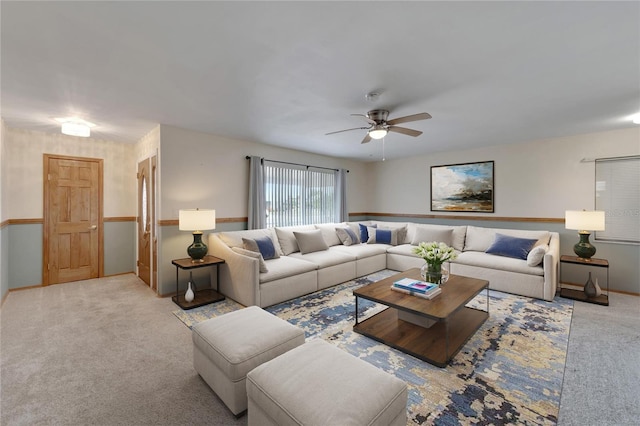 living room with light carpet and ceiling fan