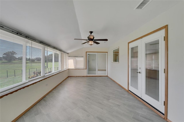 unfurnished sunroom featuring french doors, lofted ceiling, and ceiling fan