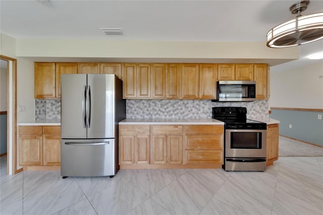 609 Fox Hills Dr, Sun City Center, FL 33573 - kitchen with stainless steel appliances, light countertops, backsplash, and light marble finish flooring