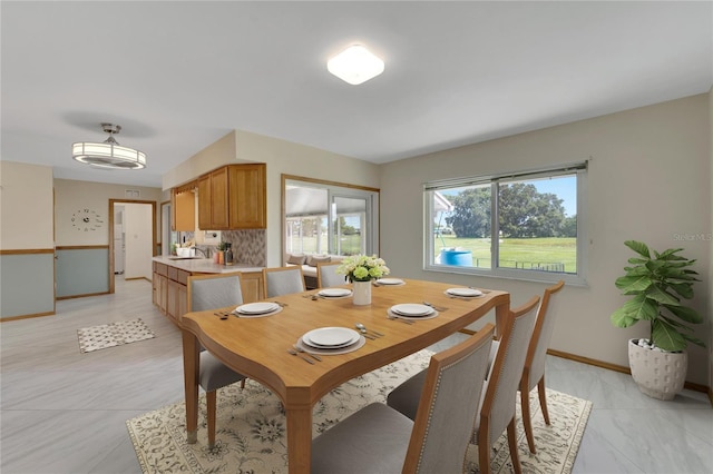 609 Fox Hills Dr, Sun City Center, FL 33573 - dining room featuring baseboards