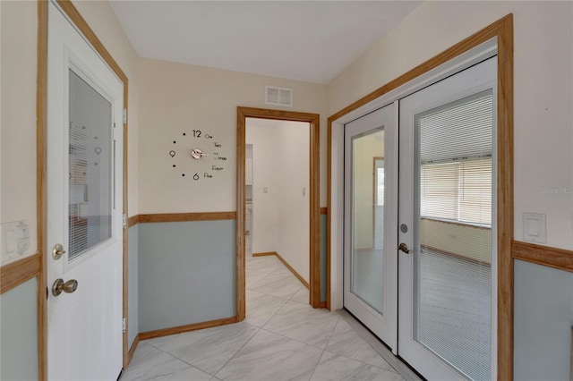 609 Fox Hills Dr, Sun City Center, FL 33573 - foyer with french doors and baseboards