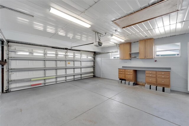 609 Fox Hills Dr, Sun City Center, FL 33573 - garage featuring a garage door opener
