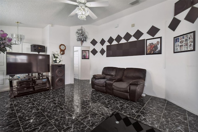 tiled living room featuring a textured ceiling, ceiling fan with notable chandelier, and a towering ceiling