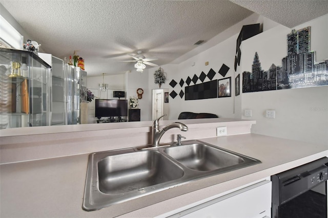 kitchen with black dishwasher, a textured ceiling, and ceiling fan