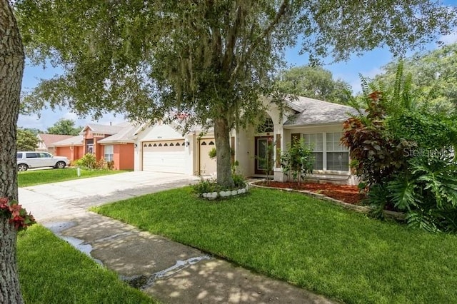 ranch-style home with a garage and a front lawn