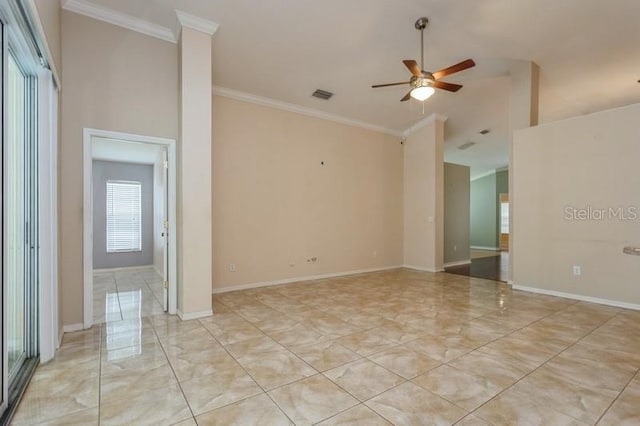 tiled empty room featuring crown molding, ceiling fan, a healthy amount of sunlight, and a towering ceiling