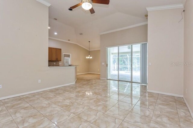 tiled spare room with ornamental molding, ceiling fan with notable chandelier, and vaulted ceiling